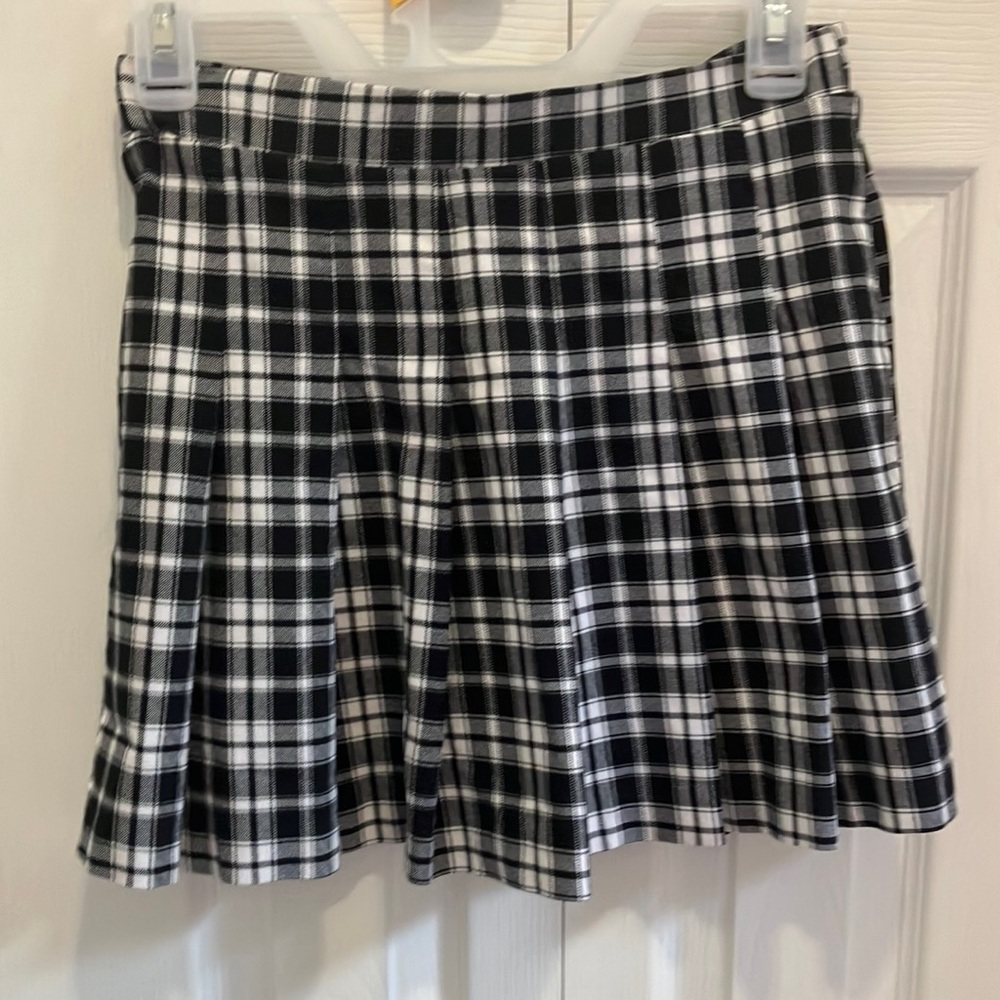 Beautiful school-style skirt with black and white tweezers designed by Joe B.